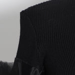Black peplum shear-sleeved sweater